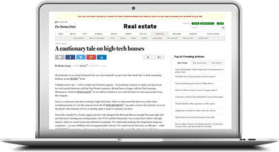 laptop with real estate article